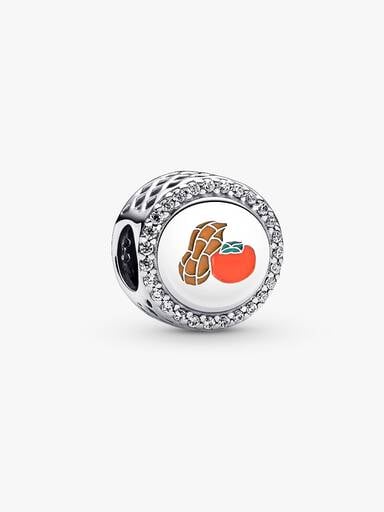Persimmon and peanut sterling silver charm with clear cubic zirconia, green, orange yam and orange enamel